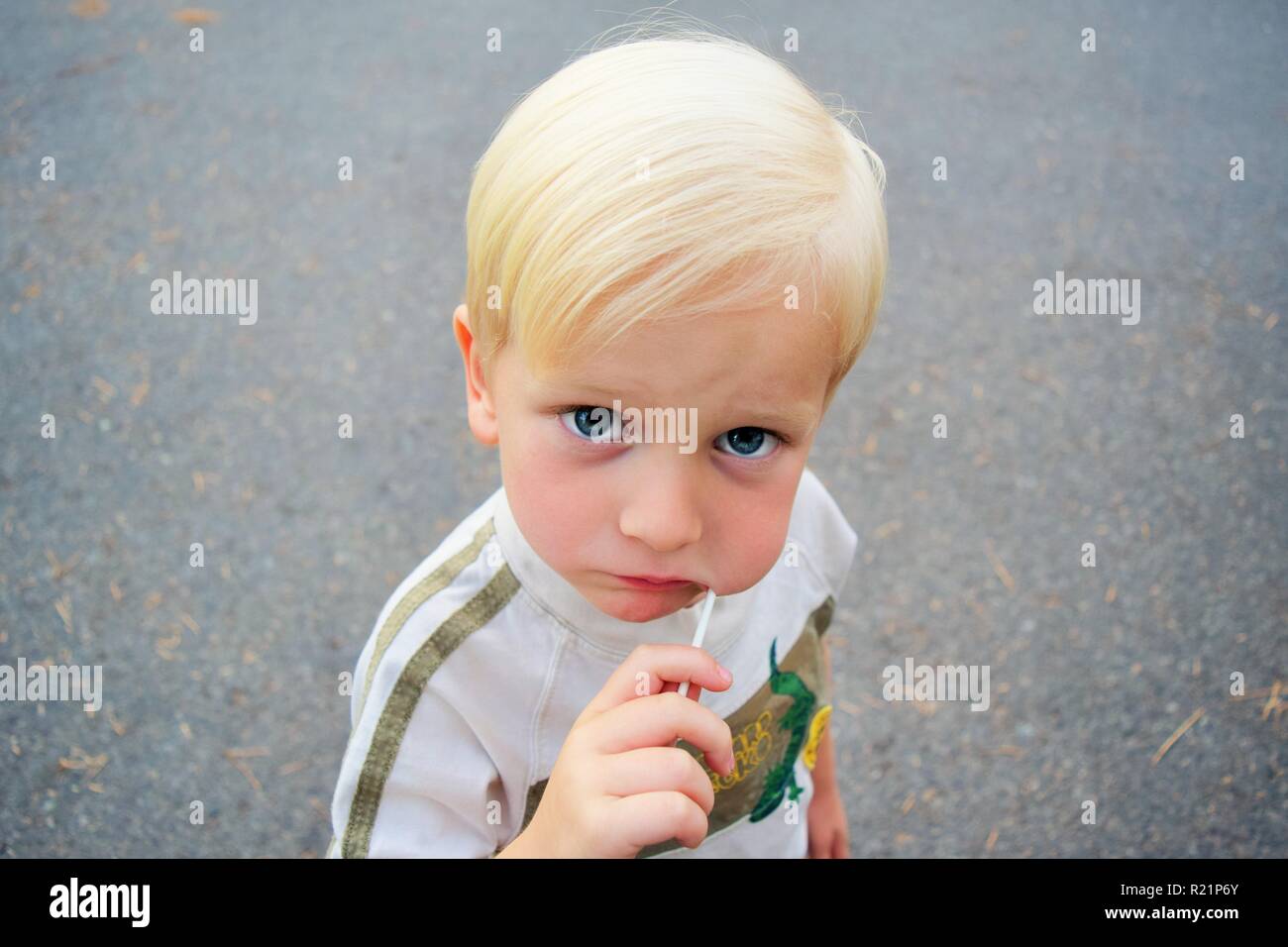 Little Boy Eating Lolly Pop Stock Photo