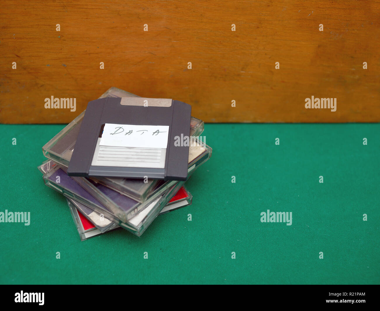 Bunch of relic floppy discs laid on the table, concept of outdated technology Stock Photo