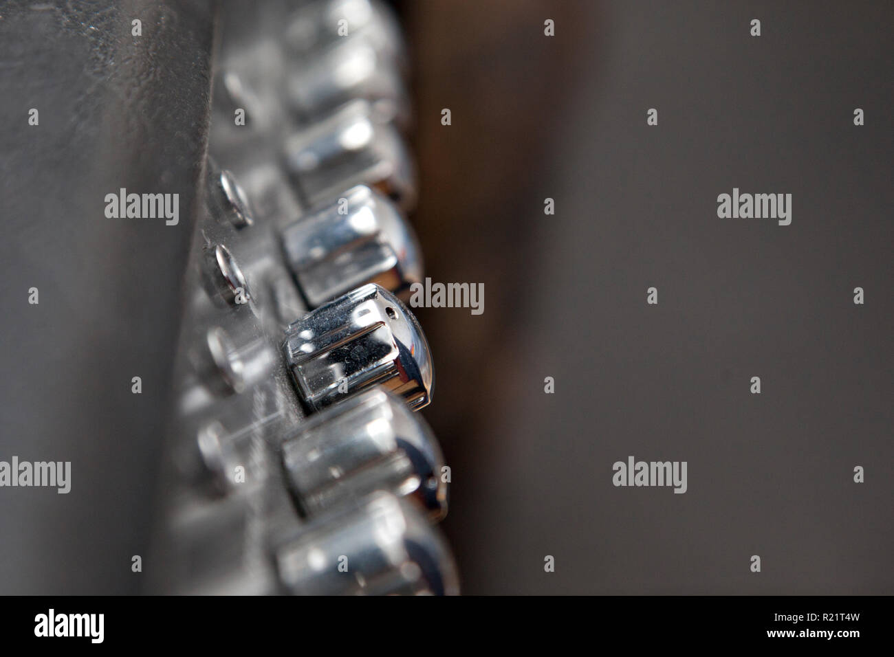 Silver knobs that adjust sound and control on a music amplifier Stock Photo