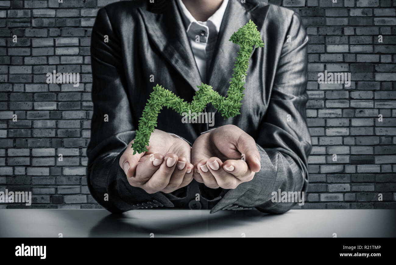 Businessman presenting growing graph Stock Photo - Alamy
