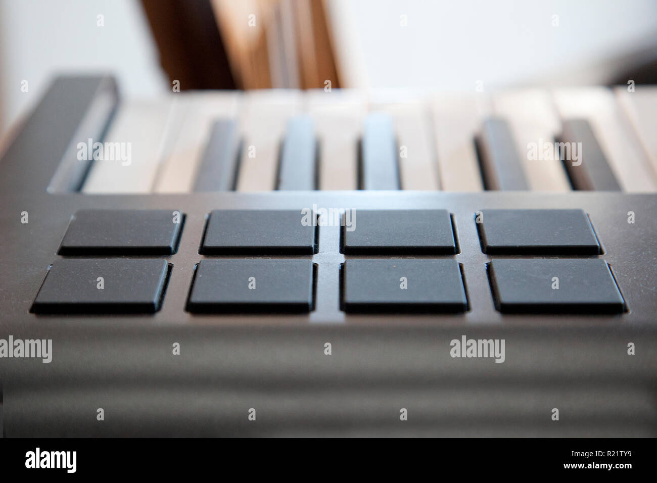 A digital piano keyboard with midi pads for creating sounds Stock Photo