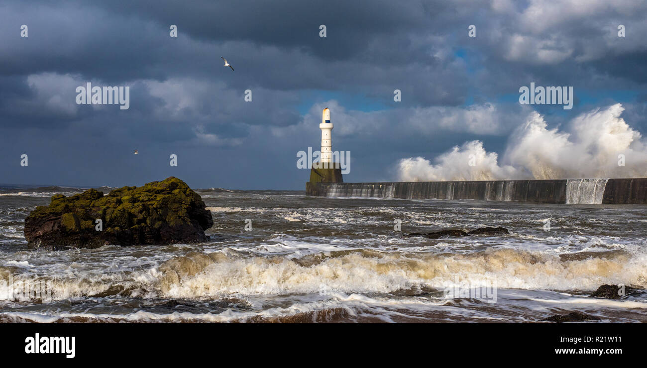 The breakwater of Aberdeen port shot on a stormy day. Stock Photo