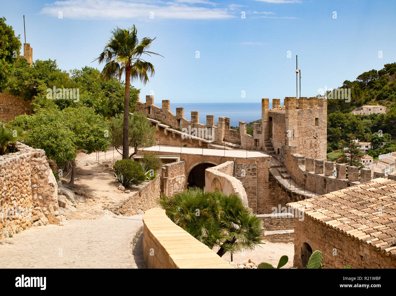 Historical Castell de Capdepera and palm trees at Mallorca Stock Photo