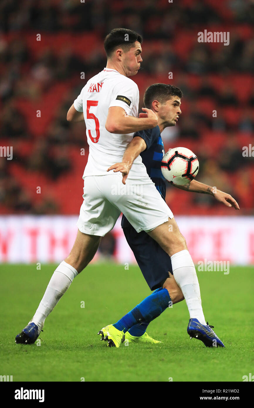 England's Michael Keane (left) and USA's Christian Pulisic battle for