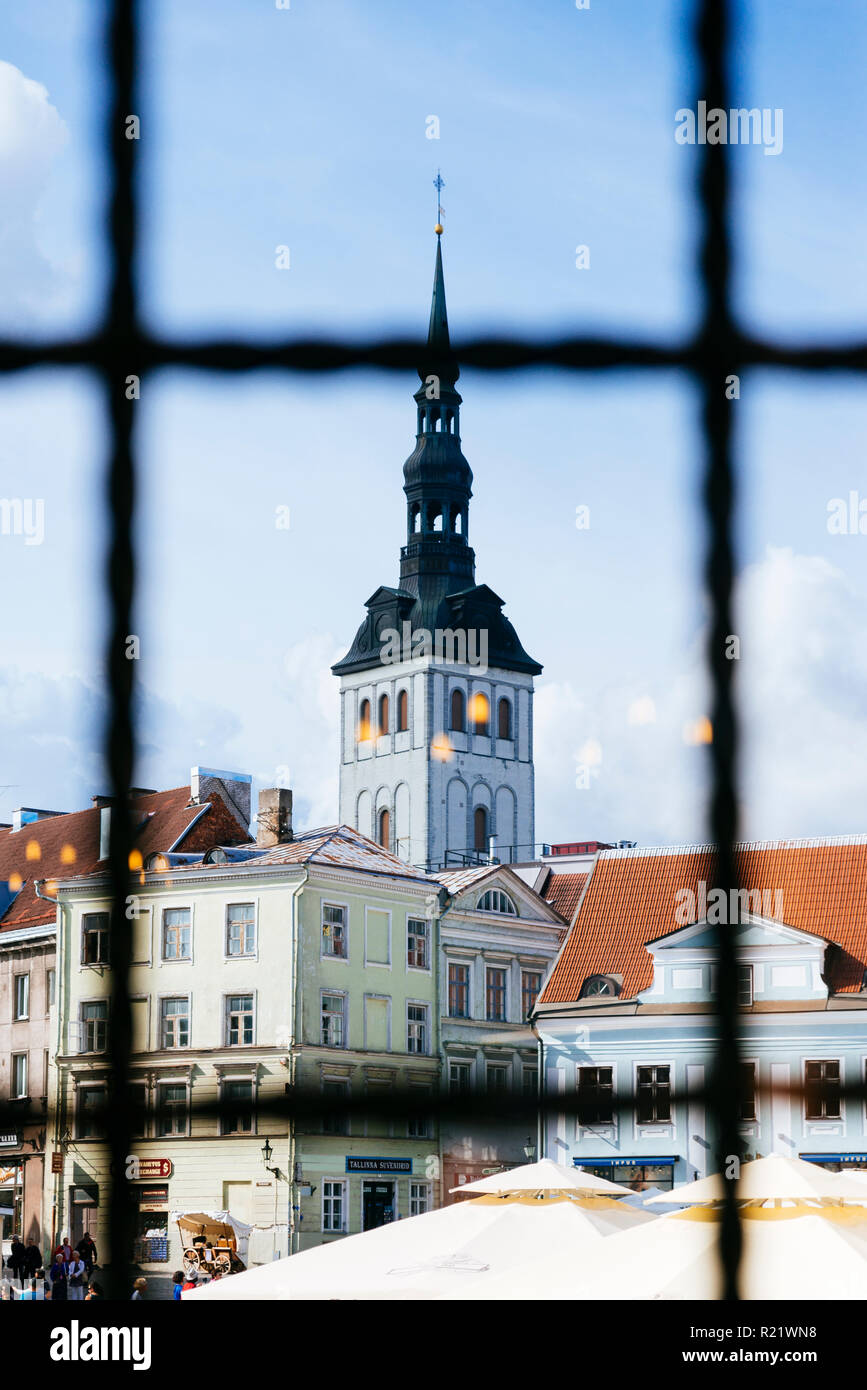 The town hall square seen from a pharmacy window and the bell tower of the church of St. Nicholas. Tallinn, Harju County, Estonia, Baltic states, Euro Stock Photo