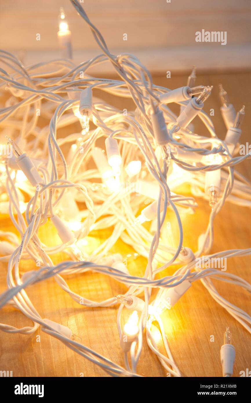 White christmas lights, some lit and some burned out, tangled up Stock