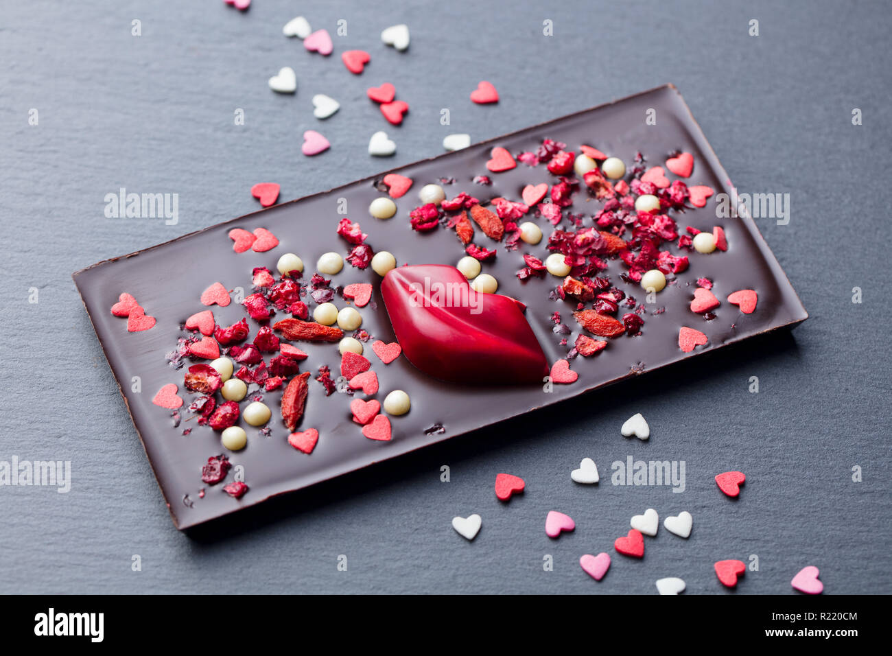Chocolate bar with heart and lips decoration. Romantic gift, present