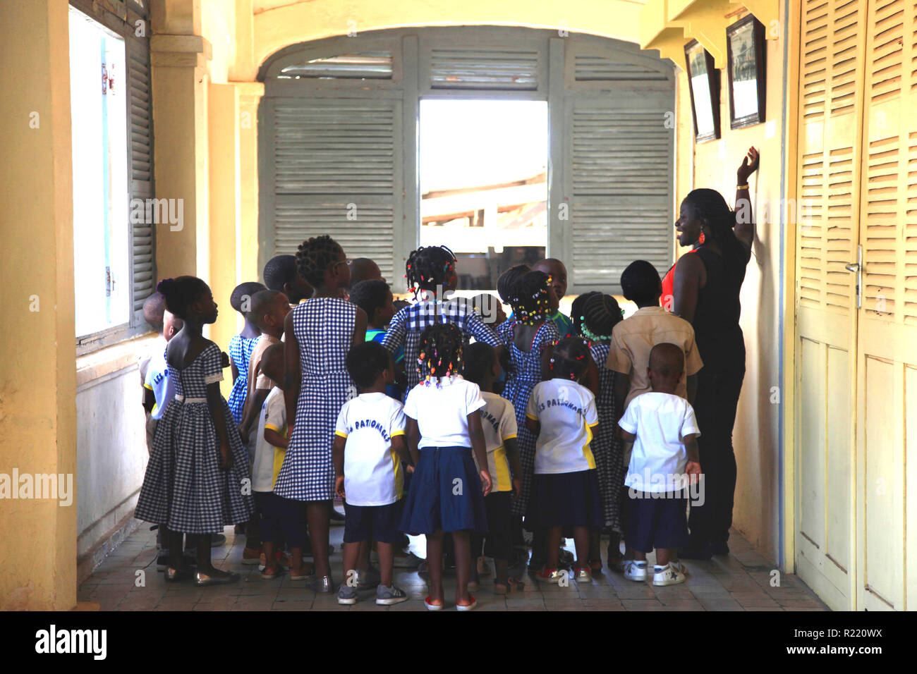 Children in School Group Les Patronages learn about colonialism and slavery at Grand Bassam, Cote d'Ivoire Stock Photo