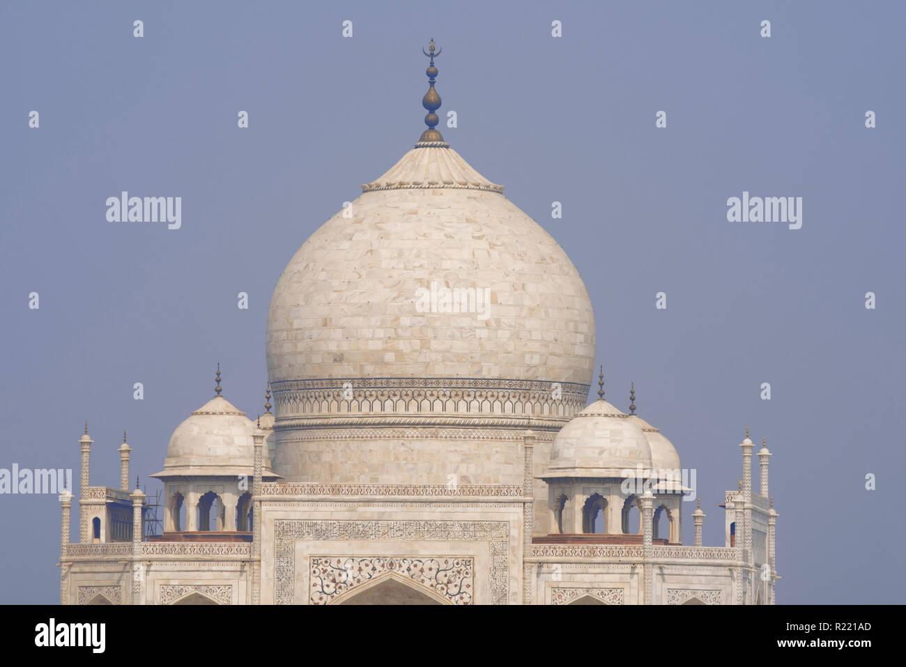 Majestic Taj Mahal the wonder of the world and the pride of India in winter morning light with its marble white main tomb and other small tombs around Stock Photo