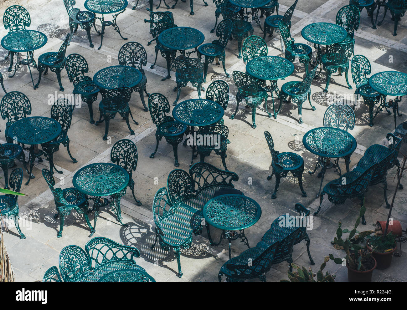 Tables and chairs in cafe in center of Valletta, Malta Stock Photo