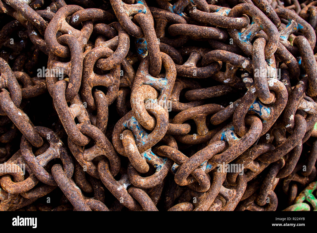 Old rusted  chains with cracked paint Stock Photo