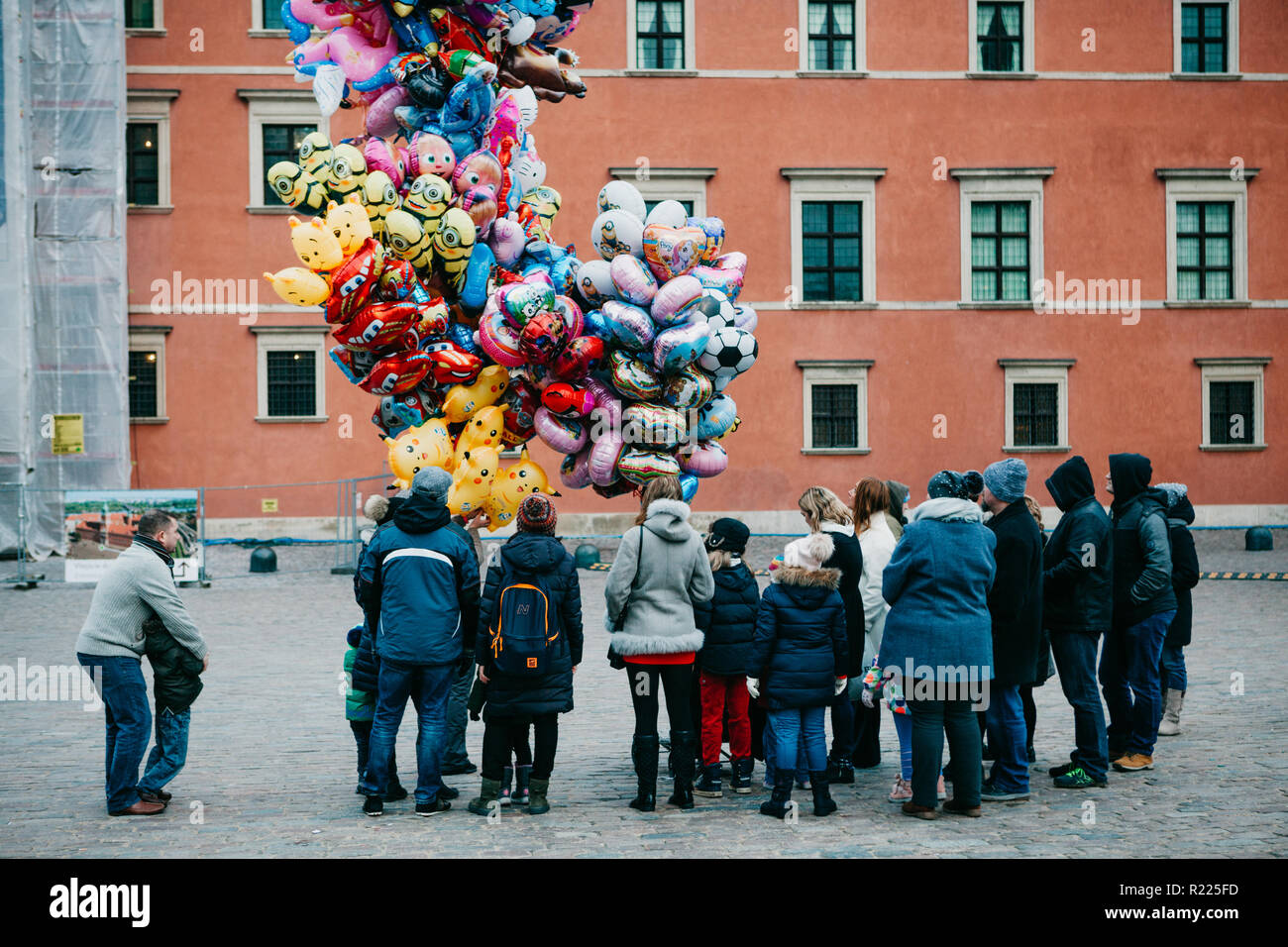 Warsaw, December 25, 2017: People in the main city square are waiting in line to buy balloons for fun. Celebration of Christmas in Europe. Stock Photo