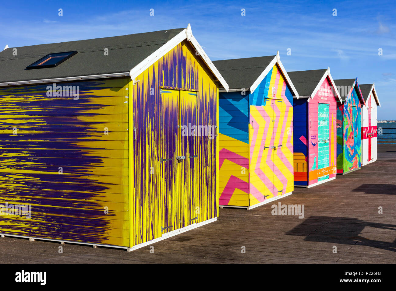 Colourful painted sheds on Southend Pier. Stock Photo