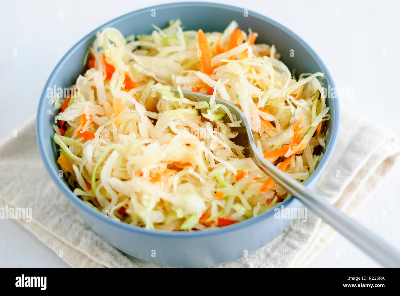 Bowl with sauerkraut and fork Stock Photo