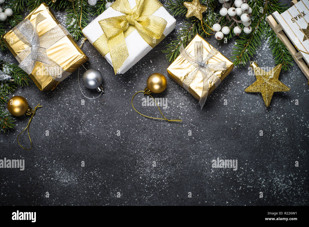 Christmas background with gold and silver decorations on black Stock ...