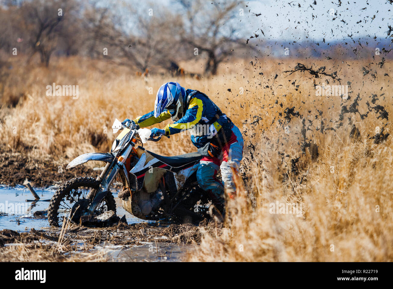 Enduro bike rider stuck in the deep mud Stock Photo Alamy