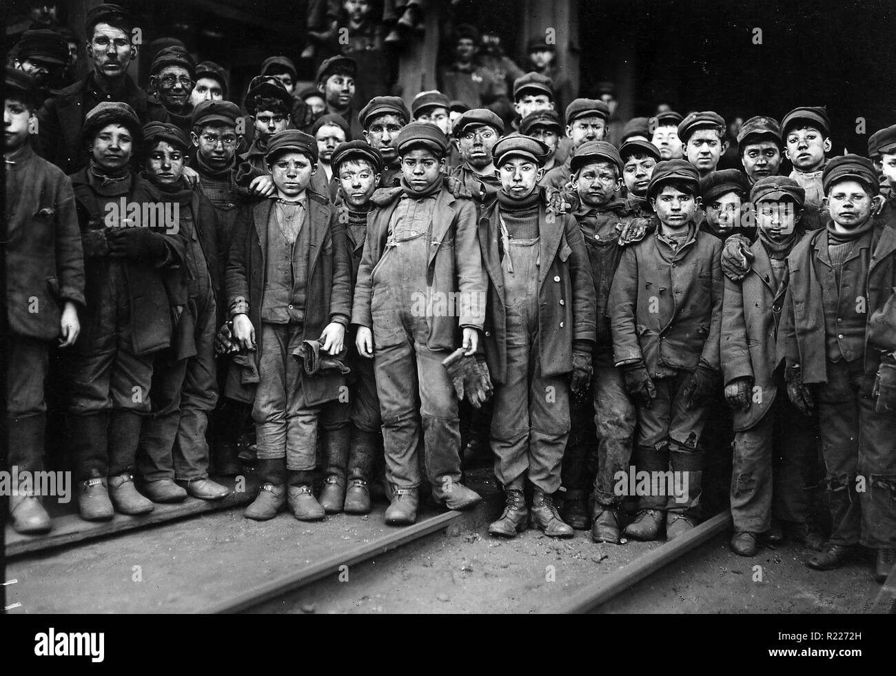 Breaker boys working in Ewen Breaker Coal Mine, South Pittston, Pennsylvania, USA 1910. A breaker boy was a coal-mining worker in the United States and United Kingdom, whose job was to separate impurities from coal by hand in a coal breaker. breaker boys were primarily children. The use of breaker boys began in the mid-1860s and did not end until the 1920s. Stock Photo