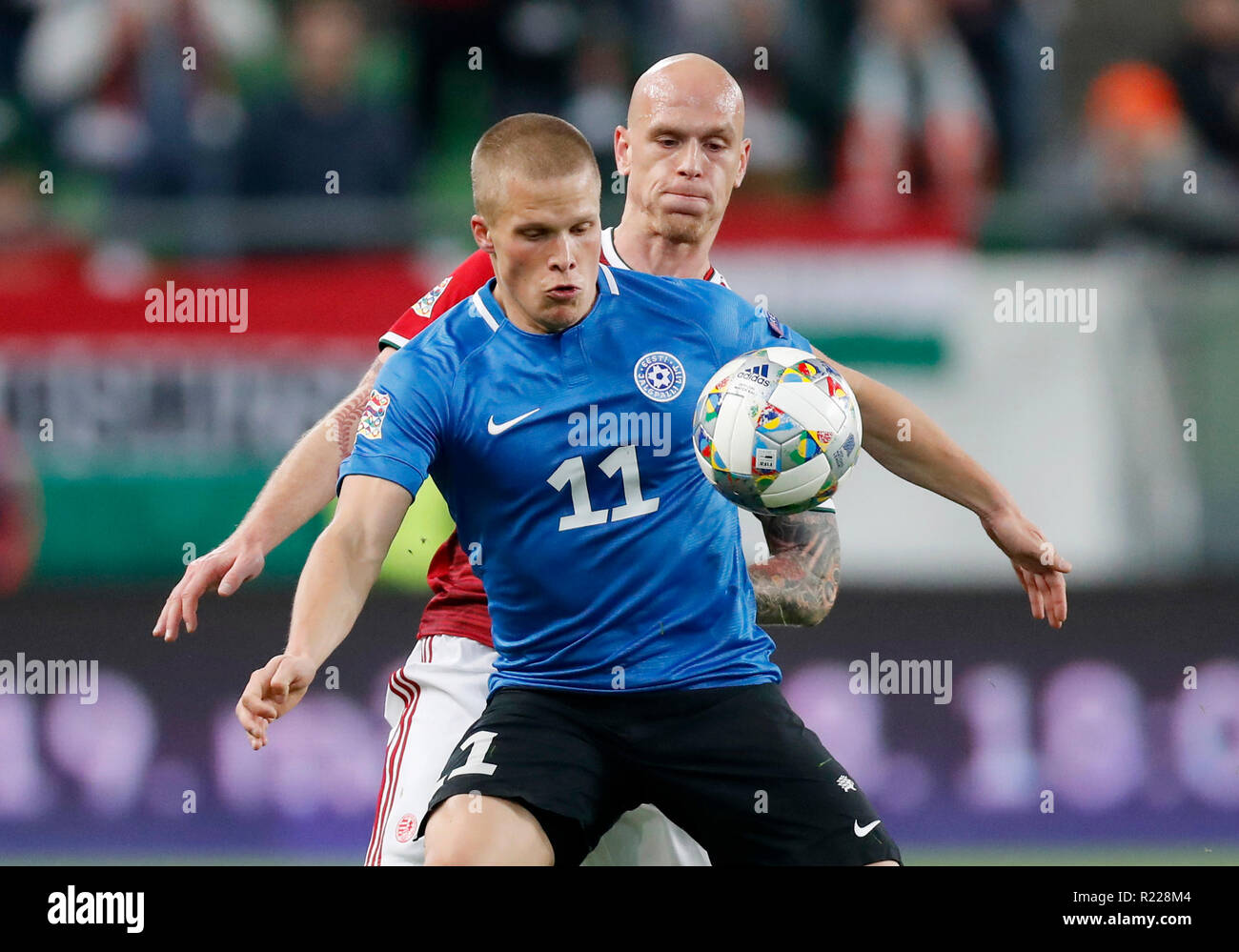 Budapest, Hungary. 15th November, 2018. Henrik Ojamaa of Estonia #11 competes for the ball with Botond Barath of Hungary (r) during the UEFA Nations League group stage match between Hungary and Estonia at Groupama Arena on November 15, 2018 in Budapest, Hungary. Credit: Laszlo Szirtesi/Alamy Live News Stock Photo