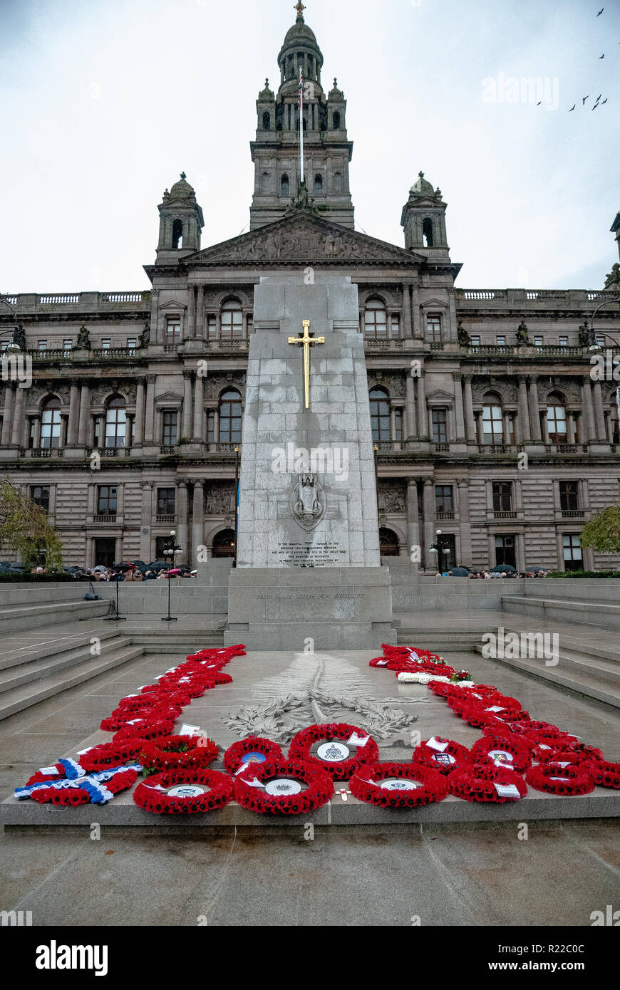 An overview of the Cenotaph after the procession with wreaths seen lying at the base.  Members of the UK armed forces, Police Scotland, Public and other services came out in support and to pay respects to those that have fallen in recent conflicts and to those that fell during the Great War. 2018 marked the 100th Year anniversary of WW1. Stock Photo
