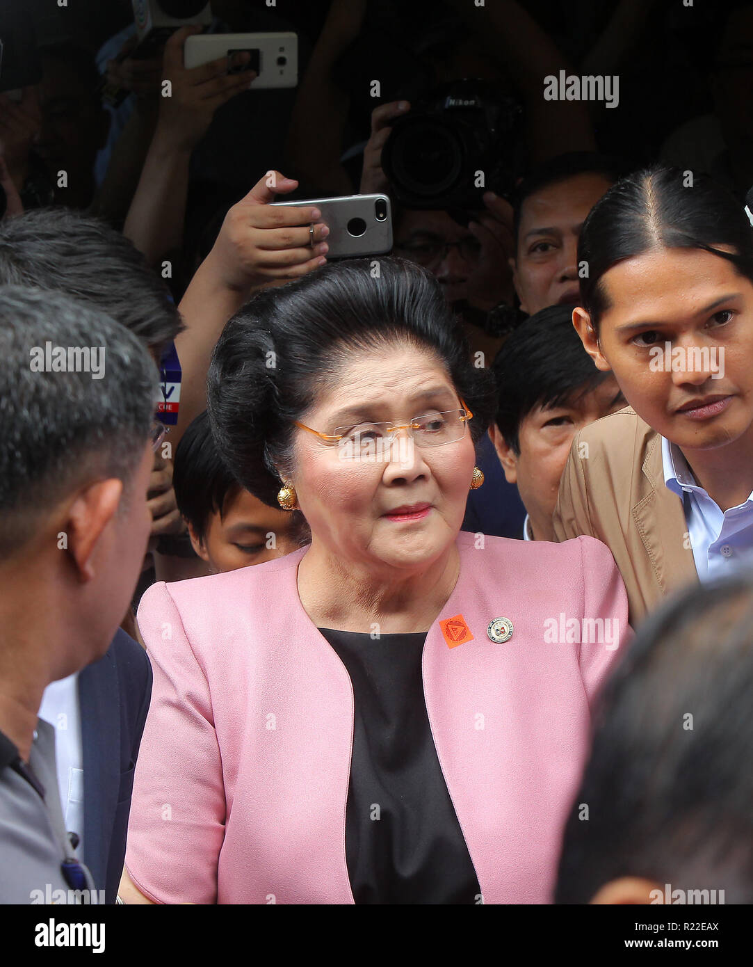Quezon City, Philippines. 16th Nov, 2018. Former First Lady Imelda Marcos (C) is seen after posting bail at an anti-corruption court in Quezon City, the Philippines, Nov. 16, 2018. A Philippine anti-graft court on Nov. 9 sentenced former First Lady Imelda Marcos to at least 42 years in prison after she was found guilty of graft for creating private foundations in Switzerland and having 'financial interests' in companies while in office from 1968 to 1986. Credit: Rouelle Umali/Xinhua/Alamy Live News Stock Photo