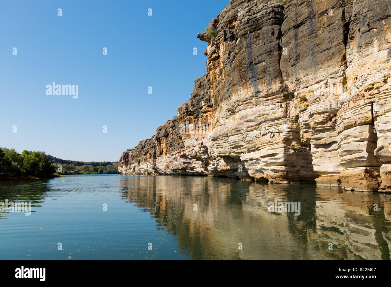Geikie Gorge has been carved by the Fitzroy River through part of an ancient limestone barrier reef which snakes across the west Kimberley. It was lai Stock Photo