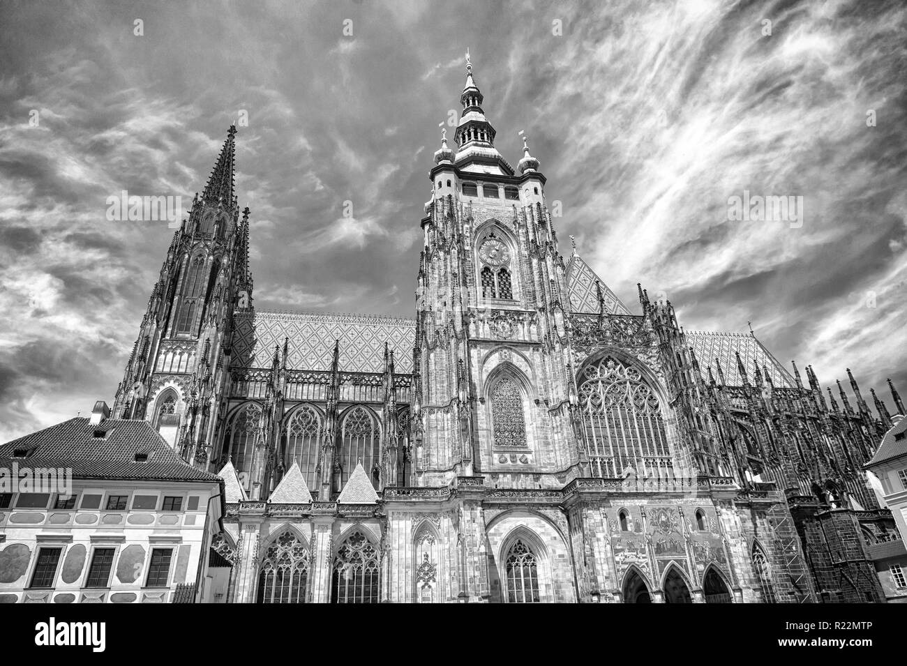 St.vitus cathedral in prague, czech republic. Church building on cloudy blue sky. Monument of gothic architecture and design. Vacation and wanderlust concept. Stock Photo