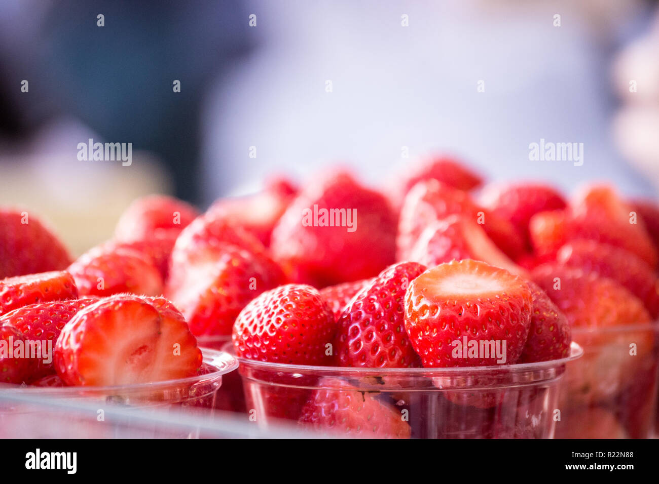 Closeup of sweet, juicy, fresh strawberries with a blurred white ...