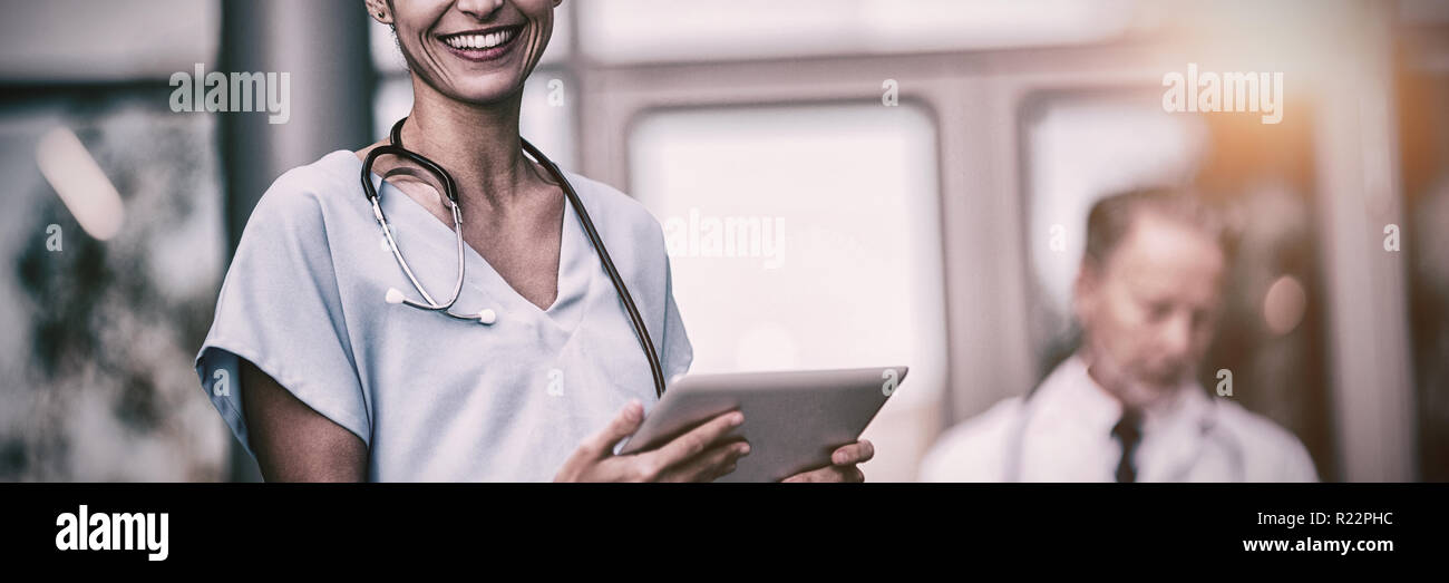 Doctor and nurse using digital tablet Stock Photo