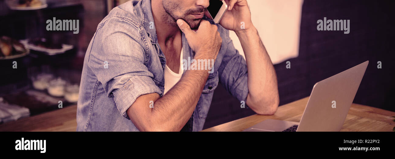 Side view of hipster man working Stock Photo