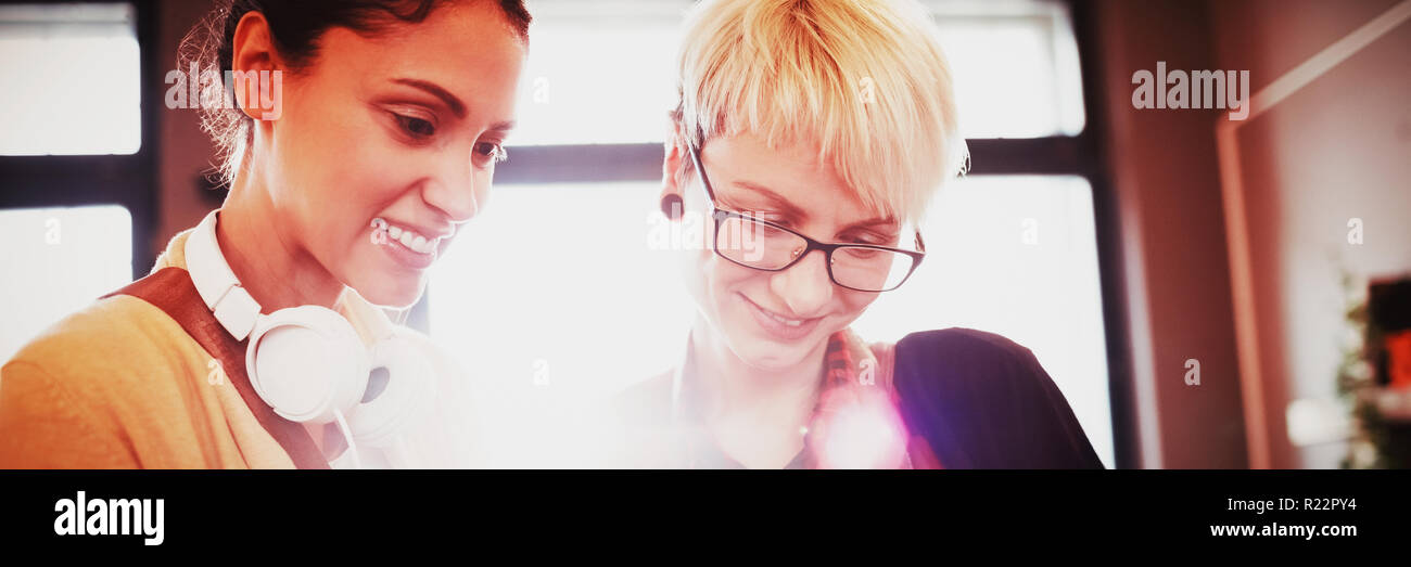 Two female graphics designer using digital tablet Stock Photo