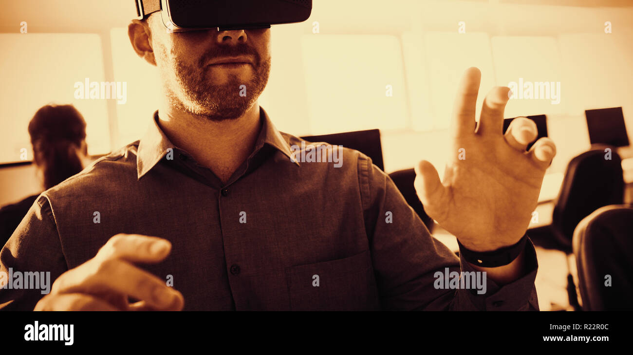 Businessman using virtual reality simulator Stock Photo