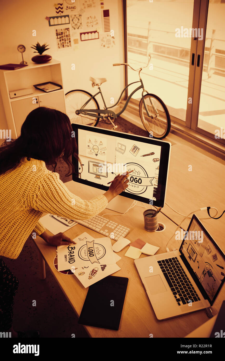 Female graphic designer working in creative office Stock Photo