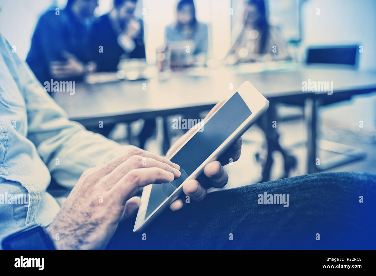 Midsection of businessman using digital tablet Stock Photo