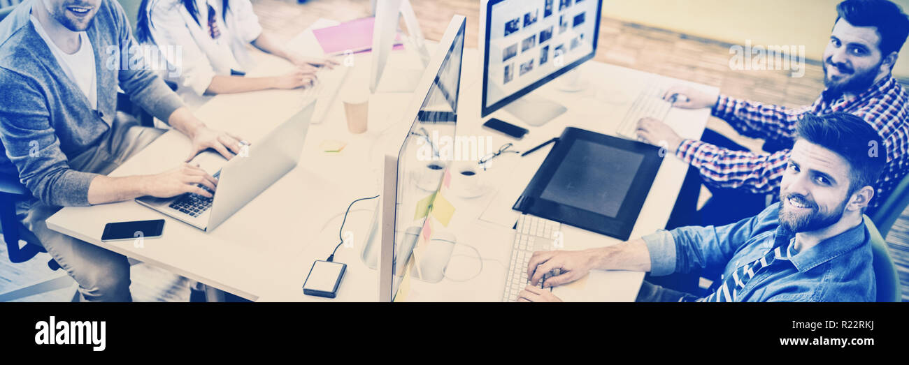 Portrait of professionals working at creative office Stock Photo