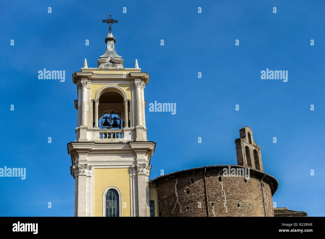 Santa Maria Delle Grazie Alle Fornaci, Italy. Bell tower. Sait Mary of Graces Church. Rome, Italy, Europe, EU. Blue sky, low angle view, pov. Stock Photo