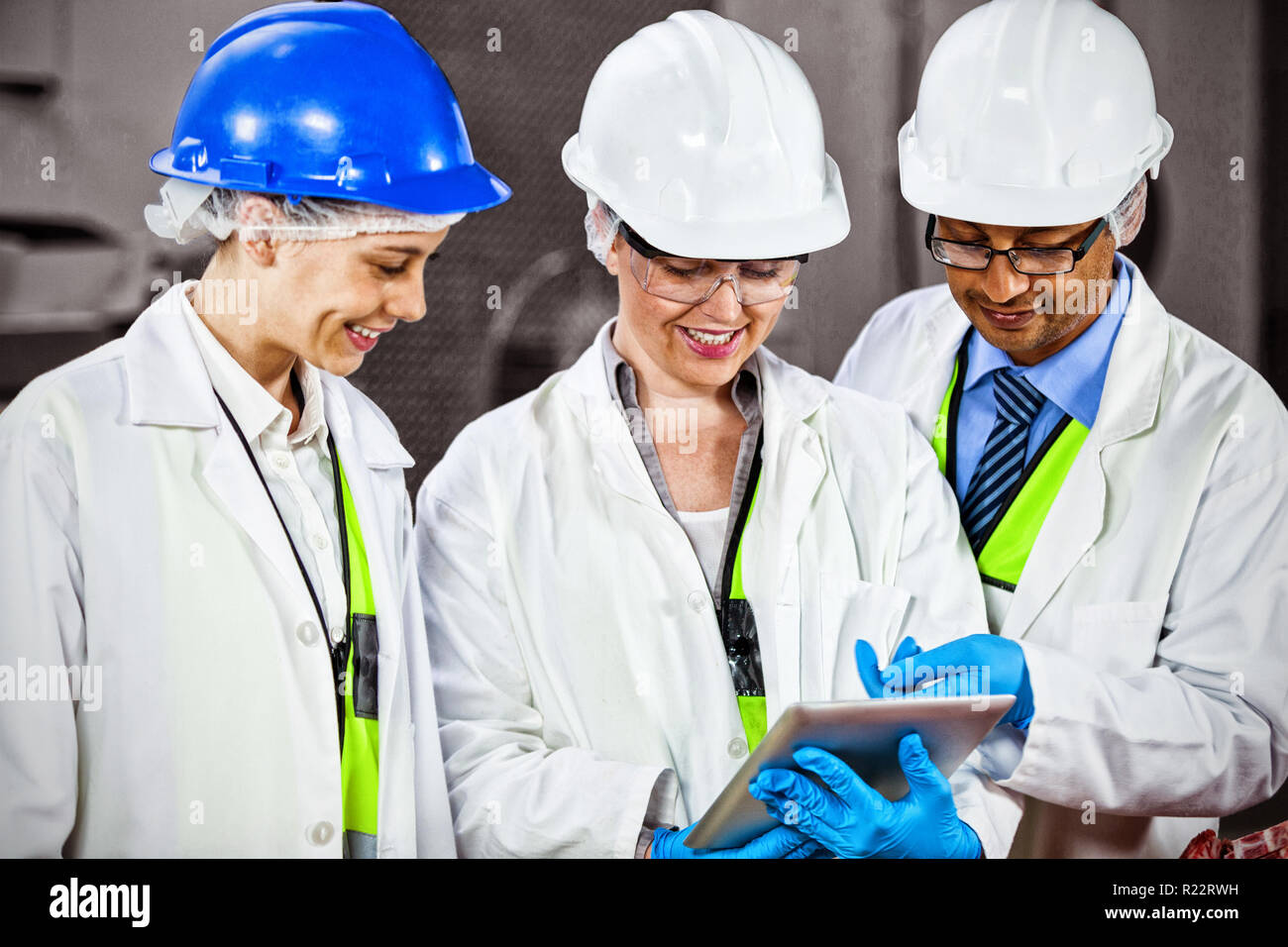 Technicians discussing over digital tablet Stock Photo