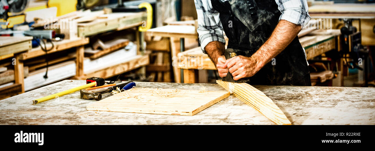 Carpenter working on his craft Stock Photo
