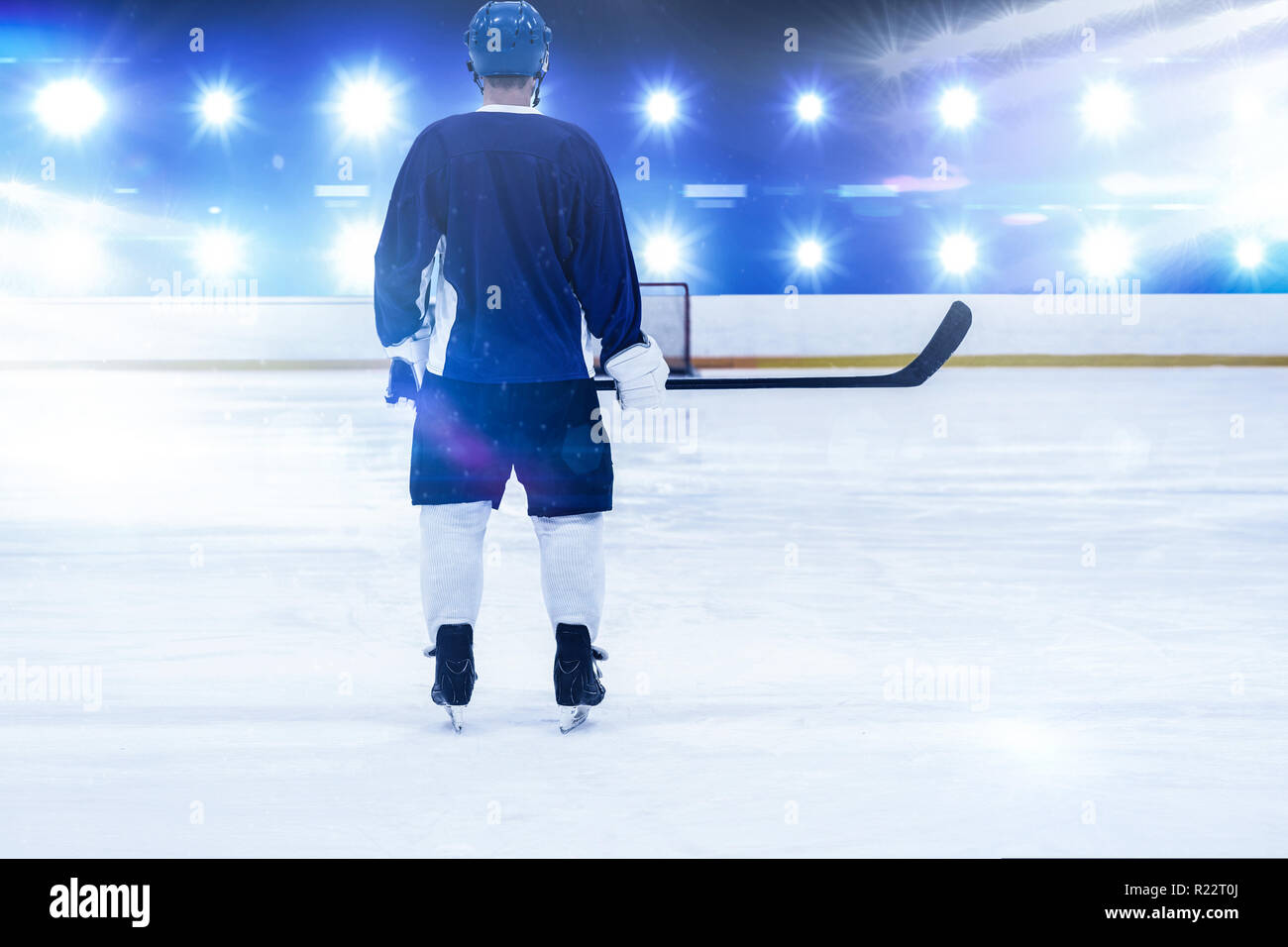 Composite image of ice hockey player on the ice Stock Photo