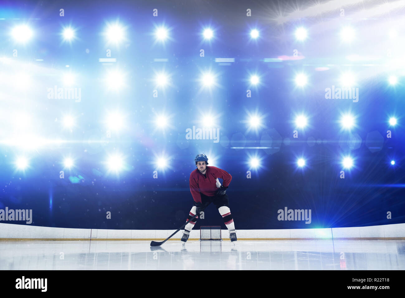 Composite image of player playing ice hockey Stock Photo