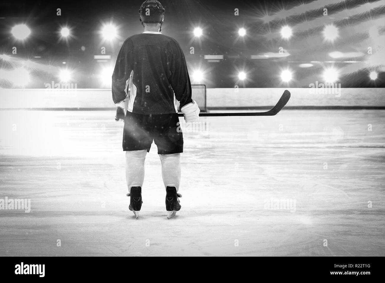 Composite image of ice hockey player on the ice Stock Photo