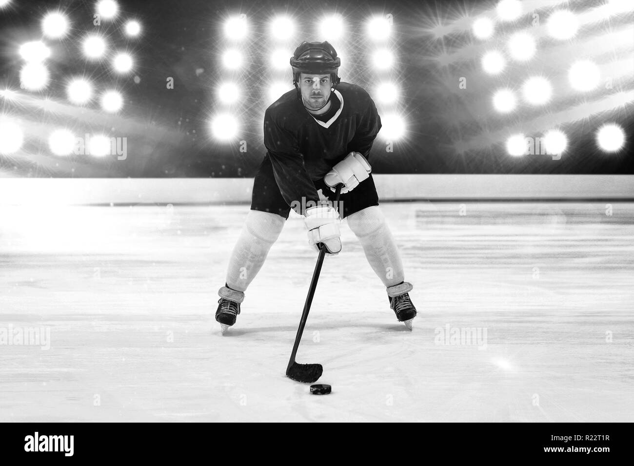 Composite image of player playing ice hockey Stock Photo