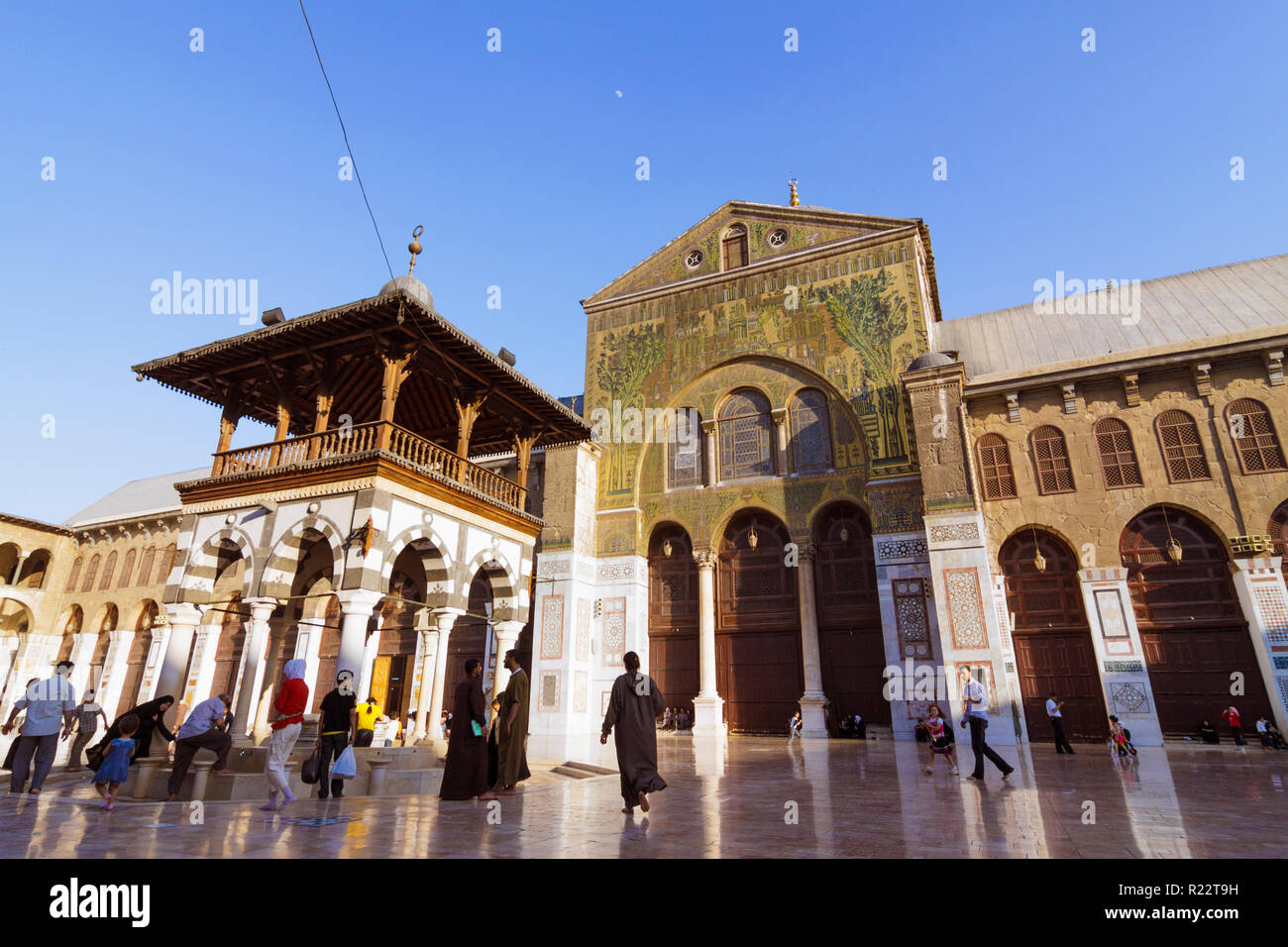 Damascus, Syria : People at the courtyard of the Umayyad Great Mosque of Damascus one of the largest and oldest in the world. Stock Photo