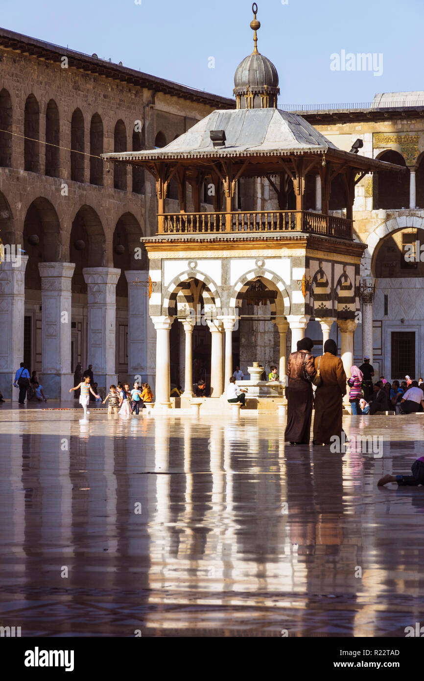 Damascus, Syria : People at the courtyard of the Umayyad Great Mosque of Damascus one of the largest and oldest in the world. Stock Photo