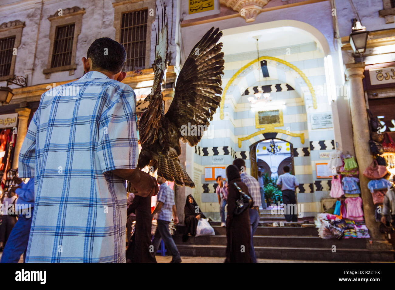 Damascus, Syria : Vendors and passersby opposite a mosque inside the Al-Hamidiyah Souq in the old town. Stock Photo