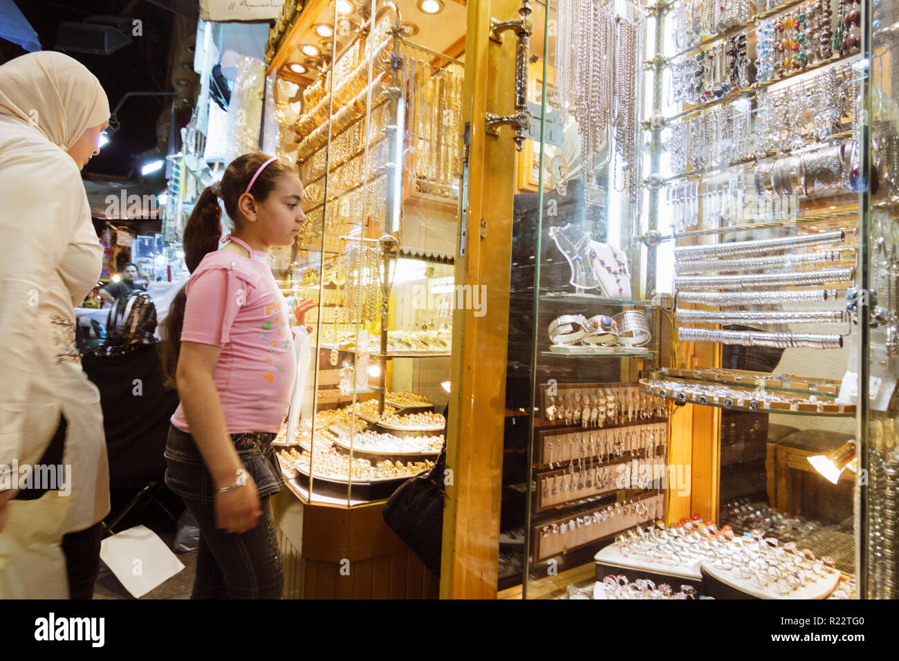 Damascus, Syria : A teen girl looks at a gold Jewellery shop at Al-Hamidiyah souq. Stock Photo