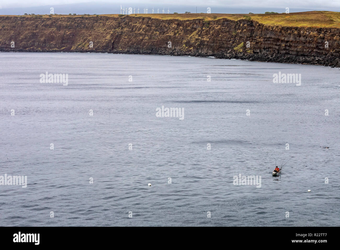 Ka Lae, Hawaii A man fishes from a kayak near the southernmost point