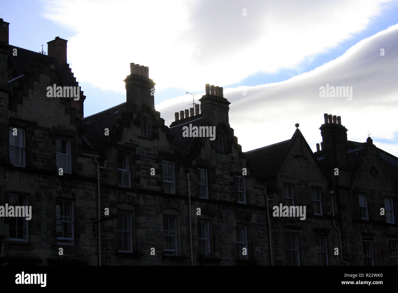 Chimney pipes silhouetted against a cloudy sky, Edinburgh, Scotland Stock Photo