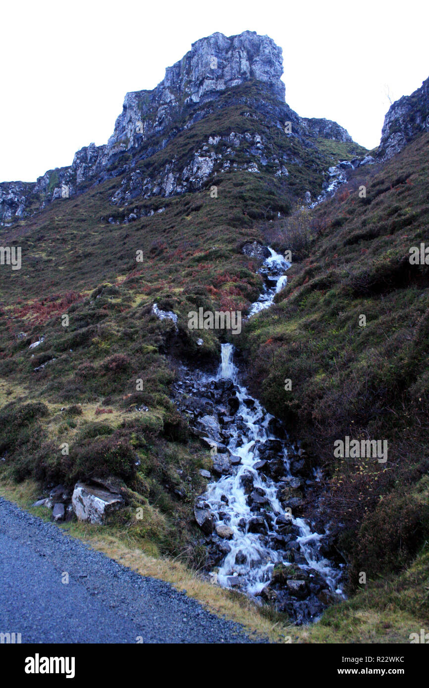 Mountain spring trickles down a bluff on Isle of Skye, Scotland Stock Photo