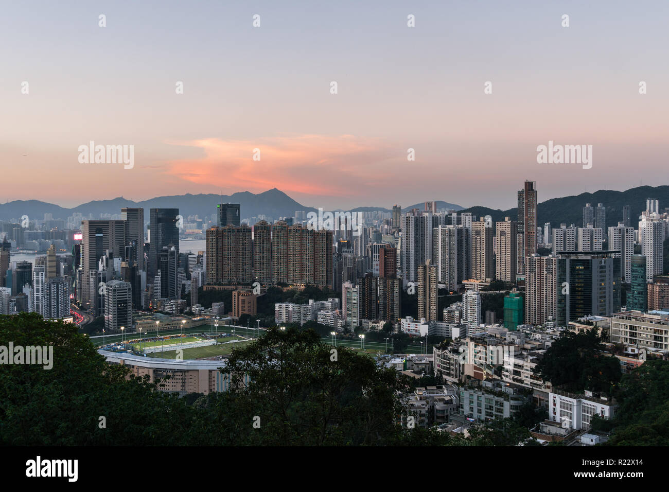 Sunset over Happy Valley district, famous for its horse racecourse  in Hong Kong island, Hong Kong SAR in China Stock Photo