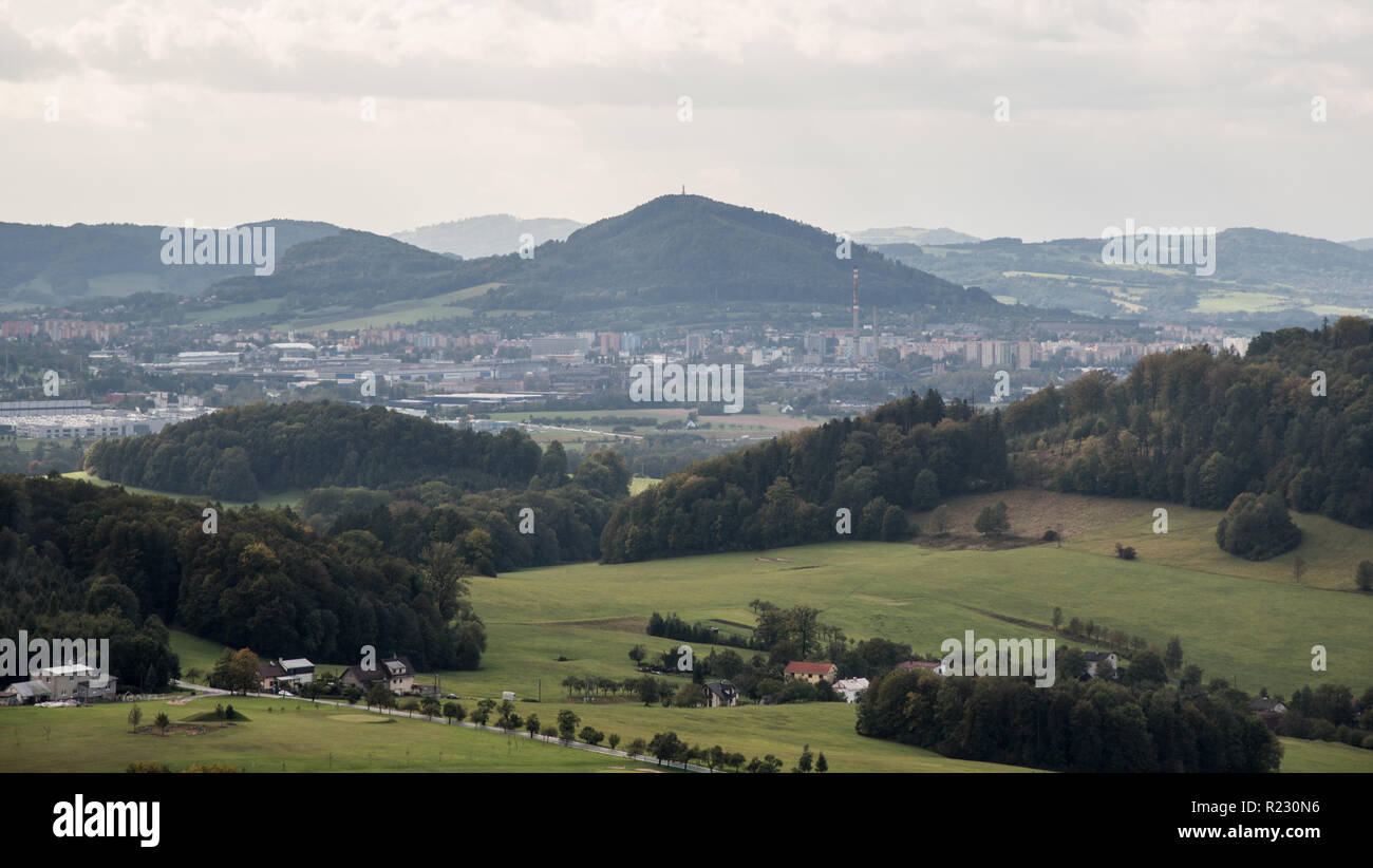 view to Koprivnice city with Bila hora and other hills of Podbeskydska pahorkatina mountains around from Hukvaldy castle ruins in Czech republic Stock Photo